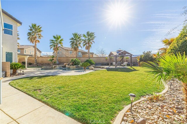 view of yard featuring a patio area and a gazebo