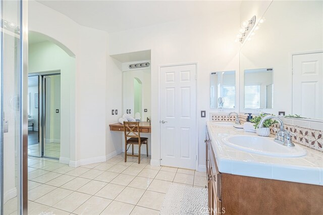 bathroom with vanity and tile patterned flooring