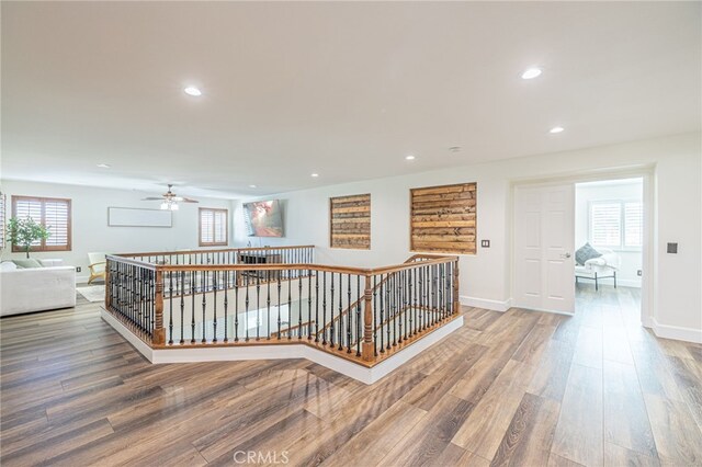 corridor featuring hardwood / wood-style floors