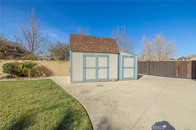 view of outbuilding with a lawn