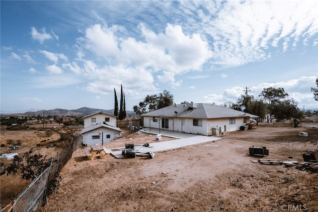 rear view of house with a mountain view