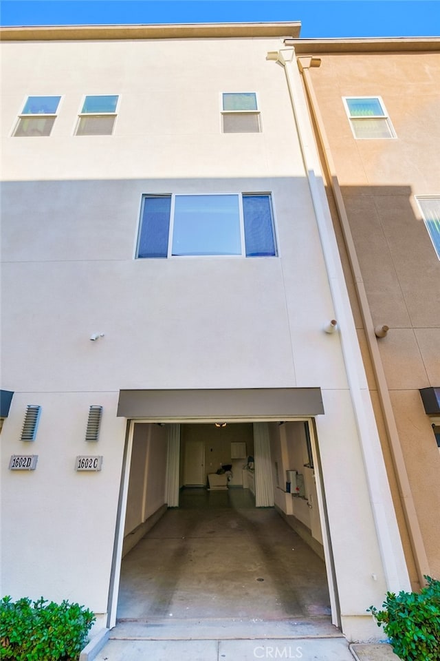 back of house with a garage