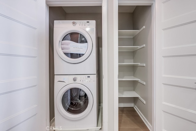 washroom with stacked washer / dryer