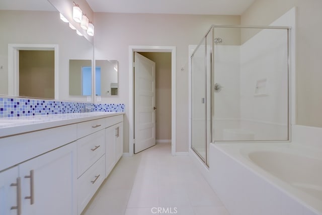 bathroom featuring independent shower and bath, tile patterned flooring, backsplash, and vanity