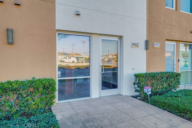 doorway to property featuring a patio