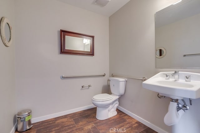 bathroom with wood-type flooring and toilet