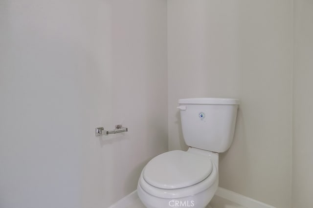 bathroom featuring toilet and tile patterned floors