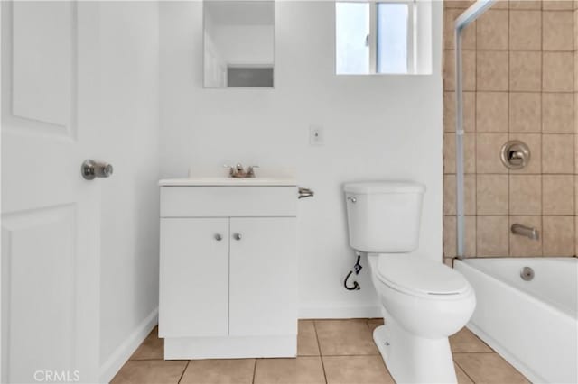 full bathroom with toilet, vanity, tile patterned floors, and tiled shower / bath