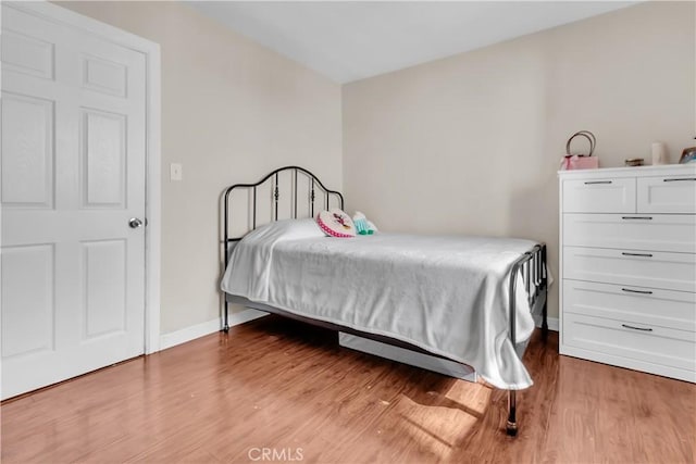 bedroom with light hardwood / wood-style floors