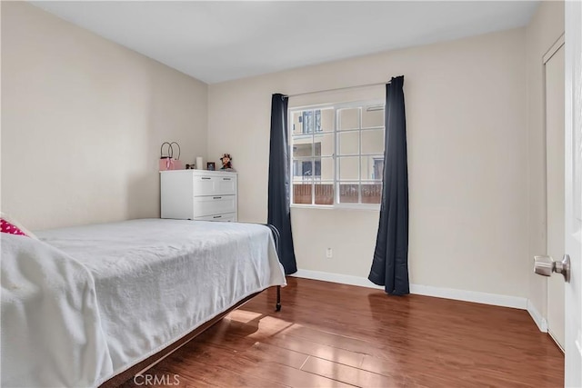 bedroom featuring dark wood-type flooring