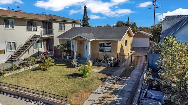 view of front facade featuring a front yard and a garage