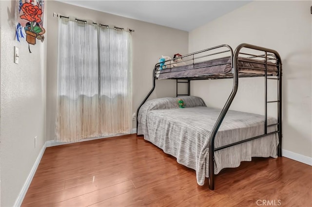 bedroom with wood-type flooring