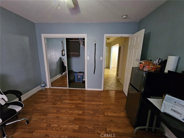 office featuring dark wood-type flooring and ceiling fan