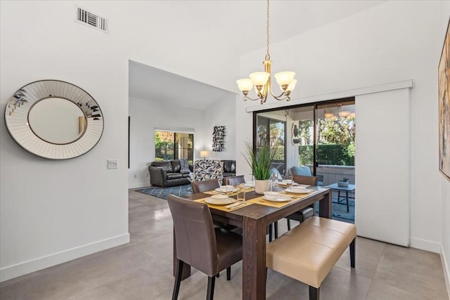 dining room with a notable chandelier