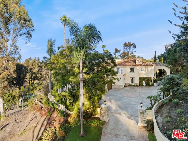 mediterranean / spanish house featuring a garage