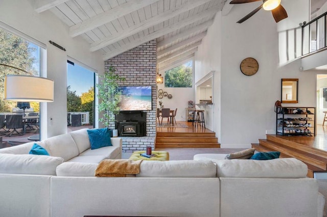 living room with high vaulted ceiling, ceiling fan, wood ceiling, and beam ceiling