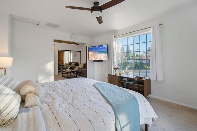 bedroom featuring light colored carpet and ceiling fan