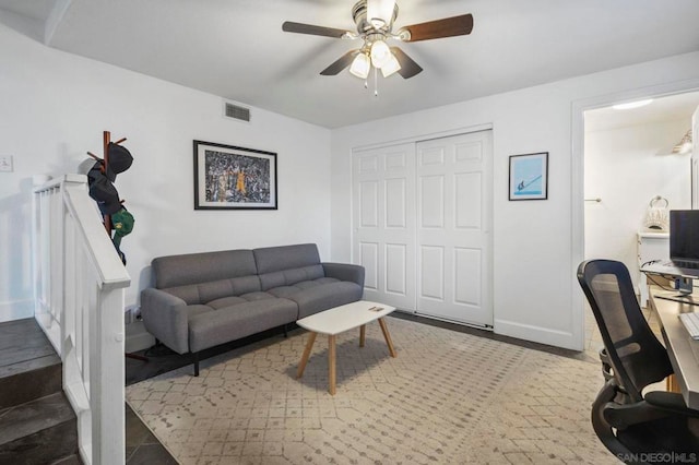 living room with ceiling fan