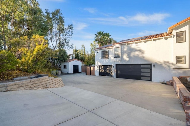 view of property exterior featuring an outdoor structure