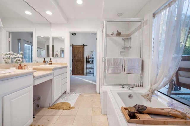 bathroom featuring tile patterned floors, independent shower and bath, and vanity