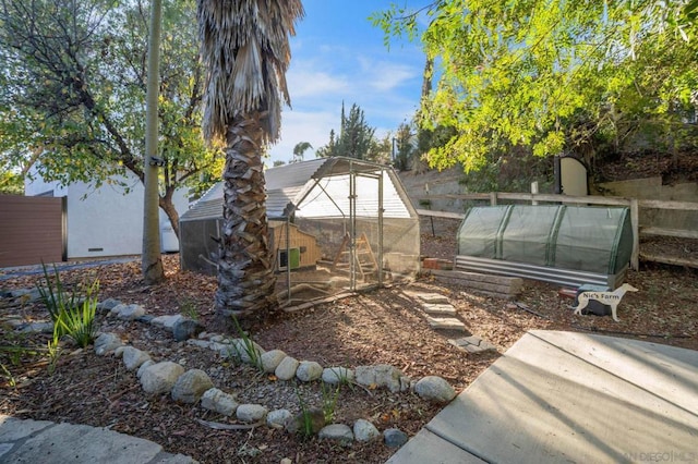 view of yard with an outdoor structure