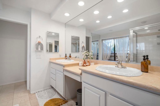 bathroom with walk in shower and vanity