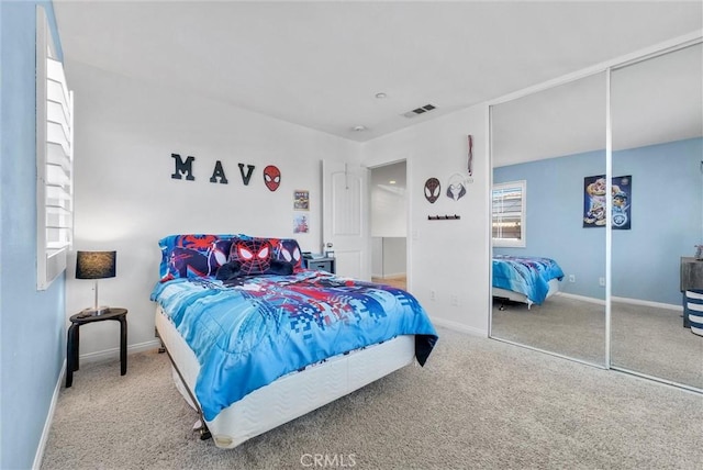 bedroom featuring a closet and carpet