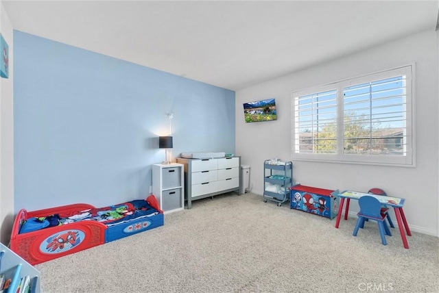 recreation room featuring carpet flooring