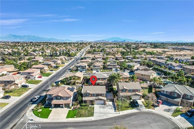 birds eye view of property with a mountain view