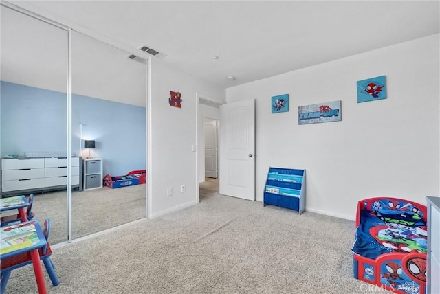 recreation room with carpet flooring