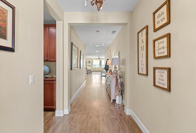 corridor featuring light hardwood / wood-style flooring