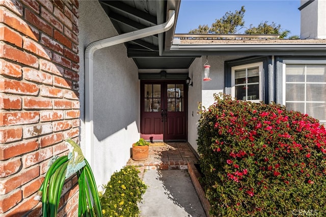 entrance to property featuring french doors