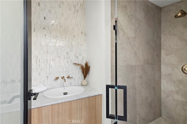 bathroom featuring a sink and a stall shower