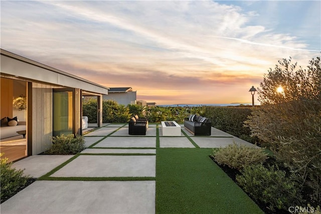 patio terrace at dusk with an outdoor hangout area