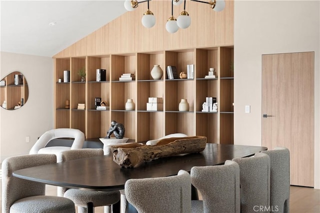 interior space with lofted ceiling and light hardwood / wood-style flooring