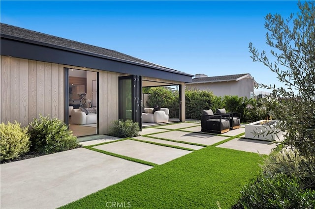 exterior space featuring a yard and a patio area