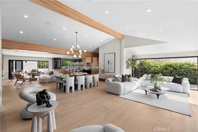 living room featuring recessed lighting, light wood-type flooring, beam ceiling, and a chandelier
