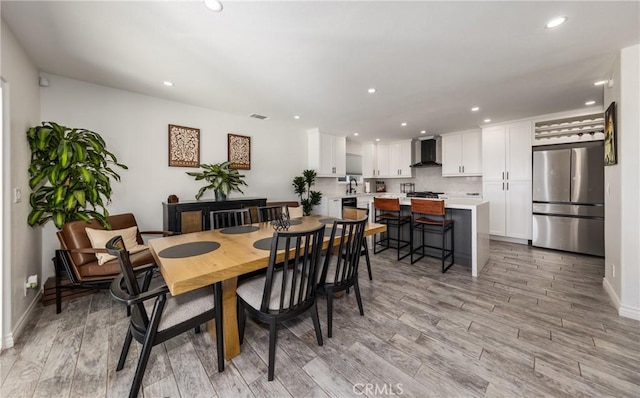 dining area with light wood-type flooring