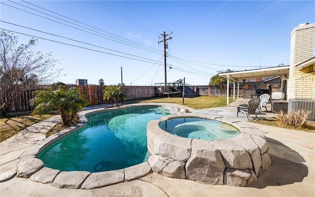 view of swimming pool featuring an in ground hot tub, central AC unit, and a patio