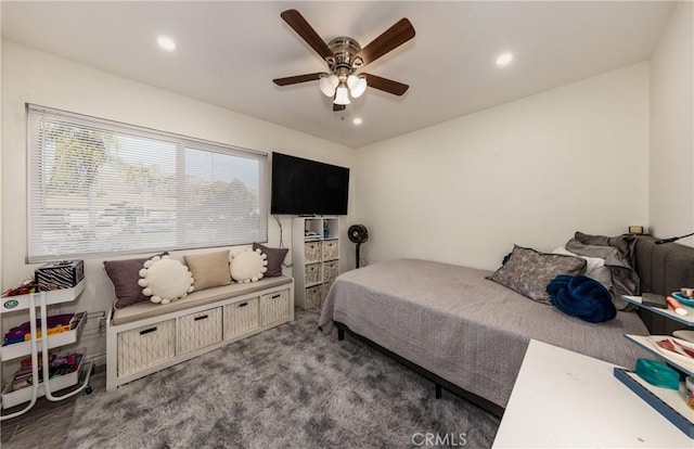 carpeted bedroom featuring ceiling fan