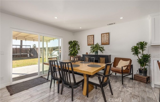 dining space featuring light hardwood / wood-style floors