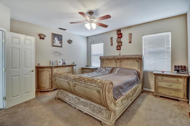 bedroom with light colored carpet and ceiling fan