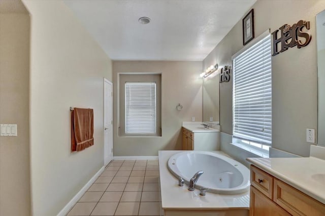 bathroom featuring vanity, tile patterned floors, and a bathtub