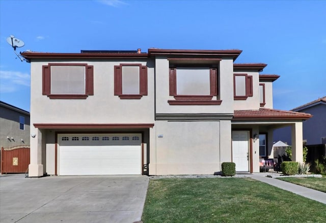 view of front facade featuring a garage and a front yard