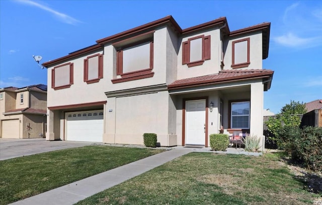 view of property featuring a garage and a front lawn