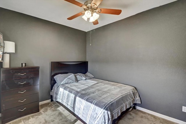 bedroom with light colored carpet and ceiling fan