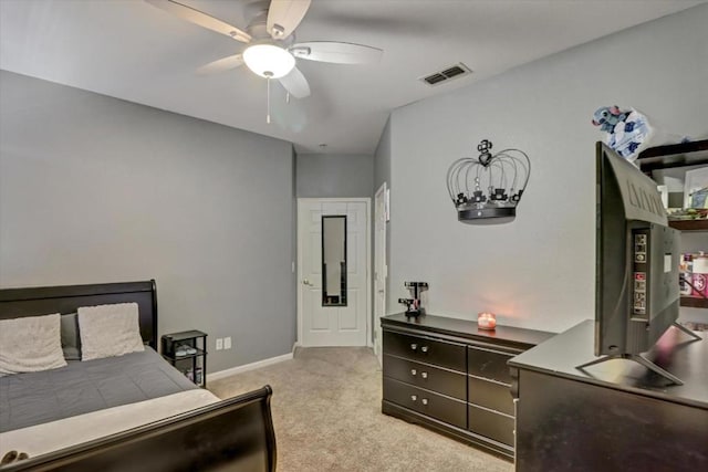 bedroom featuring light colored carpet and ceiling fan