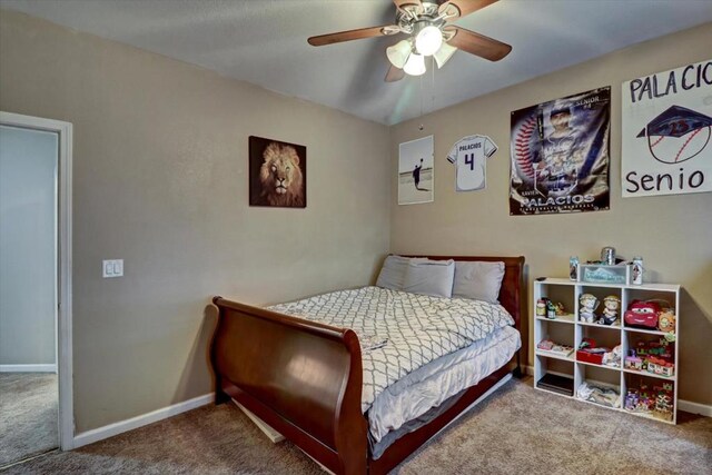 bedroom with ceiling fan and carpet floors