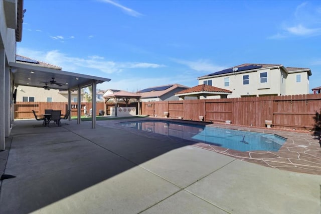 view of pool featuring a gazebo, ceiling fan, and a patio area