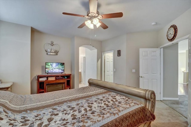 bedroom with light carpet and ceiling fan